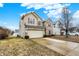 View of charming two-story home with a two-car garage and long driveway at 3844 Kilburn Ct, Indianapolis, IN 46228