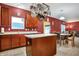 Spacious kitchen featuring a center island, stainless steel sink, and ample counter space at 3844 Kilburn Ct, Indianapolis, IN 46228