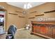 Comfortable room with a large bar area, shelves, and plenty of space for storage at 3844 Kilburn Ct, Indianapolis, IN 46228