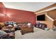 Relaxing room with comfortable sofas, carpet flooring, and a TV setup at 3844 Kilburn Ct, Indianapolis, IN 46228