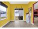 Bright sunroom with sliding glass doors leading to the backyard and ample natural light at 3844 Kilburn Ct, Indianapolis, IN 46228