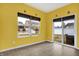 Sunny sunroom with large windows offering views of the backyard and neighborhood at 3844 Kilburn Ct, Indianapolis, IN 46228