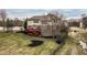 Aerial view of the backyard shows mature trees and a large deck overlooking expansive backyard at 3880 Heathfield Ct, Zionsville, IN 46077