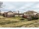 View of the home's backyard and deck, emphasizing the outdoor living space and landscaped yard at 3880 Heathfield Ct, Zionsville, IN 46077
