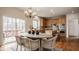 Bright dining area featuring a view of the back deck, stylish furnishings, and ample natural light at 3880 Heathfield Ct, Zionsville, IN 46077