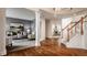 Open-concept living room with hardwood floors and a view of the living room and staircase at 3880 Heathfield Ct, Zionsville, IN 46077