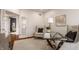 Well-lit office space with stylish furnishings, neutral decor, and a view of the open doorway at 3880 Heathfield Ct, Zionsville, IN 46077