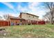 Home's backyard with a brick facade and a grassy lawn at 3968 Creekwood Dr, Greenwood, IN 46142