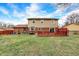 A view of the home's backyard with a wooden deck and patio at 3968 Creekwood Dr, Greenwood, IN 46142