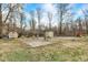 Home's backyard features a basketball court and storage sheds at 3968 Creekwood Dr, Greenwood, IN 46142