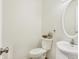 Powder room featuring a white sink and toilet at 3968 Creekwood Dr, Greenwood, IN 46142