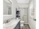Bathroom featuring a spacious vanity, updated floors, and a glass-enclosed shower at 3968 Creekwood Dr, Greenwood, IN 46142