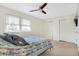 Spacious bedroom featuring carpet, ceiling fan, and double closets at 3968 Creekwood Dr, Greenwood, IN 46142