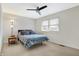 Bright bedroom with ceiling fan, carpet, and natural light from the window at 3968 Creekwood Dr, Greenwood, IN 46142