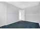 Bedroom has freshly painted light gray walls, white trim, and carpet at 3968 Creekwood Dr, Greenwood, IN 46142