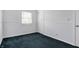 Bedroom boasts white trim and carpet, and features a window and closet at 3968 Creekwood Dr, Greenwood, IN 46142