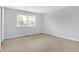 Bright bedroom features a large window and neutral carpeting at 3968 Creekwood Dr, Greenwood, IN 46142
