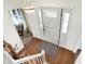 Bright foyer features hardwood floors, and a white door with sidelights at 3968 Creekwood Dr, Greenwood, IN 46142