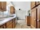 Functional kitchen with light countertops, wood cabinets, and linoleum floors at 3968 Creekwood Dr, Greenwood, IN 46142