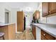 Eat-in kitchen boasts wood cabinets, updated countertops, and an eat-in peninsula at 3968 Creekwood Dr, Greenwood, IN 46142