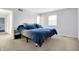 Spacious main bedroom boasts soft carpeting, natural light, and a calming neutral palette at 3968 Creekwood Dr, Greenwood, IN 46142