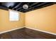 This finished basement offers modern flooring and versatile area for extra storage or living at 4212 Broadway St, Indianapolis, IN 46205