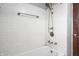 Bathroom with white subway tile surround and updated fixtures at 4212 Broadway St, Indianapolis, IN 46205