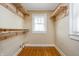 This closet space has custom wood shelving and lots of space for storage and organizing clothing at 4212 Broadway St, Indianapolis, IN 46205