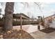 A wooden deck with a rustic pergola covers a sitting area with a fire pit at 4212 Broadway St, Indianapolis, IN 46205