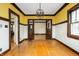 Elegant dining room featuring hardwood floors, classic trim, and ample space for entertaining and Gathering gatherings at 4212 Broadway St, Indianapolis, IN 46205