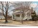 A beautiful home highlighting a serene front yard, showcasing architectural details and a welcoming entrance at 4212 Broadway St, Indianapolis, IN 46205