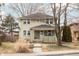 Charming two-story home with a well-maintained front yard and inviting curb appeal, showcasing traditional architecture at 4212 Broadway St, Indianapolis, IN 46205