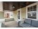 Cozy covered porch featuring a comfortable seating area, providing a perfect spot for relaxation and enjoying the outdoors at 4212 Broadway St, Indianapolis, IN 46205
