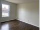 Bedroom with a large window and hardwood floors at 457 Prince Dr, Greenwood, IN 46142