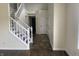 Welcoming foyer with hardwood floors and staircase at 457 Prince Dr, Greenwood, IN 46142
