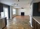 Open concept living room with a decorative fireplace and ample natural light at 457 Prince Dr, Greenwood, IN 46142