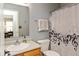 Bright bathroom with shower/tub combination, single sink vanity, and neutral wall color at 4704 Whitview Ln, Indianapolis, IN 46237