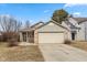 Charming single Gathering home with a two-car garage, small porch, and partial brick facade at 4704 Whitview Ln, Indianapolis, IN 46237