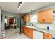 Well-lit kitchen with stainless steel appliances, light wood cabinets and sleek countertops at 4704 Whitview Ln, Indianapolis, IN 46237