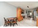 Charming eat-in kitchen with stainless steel oven, sleek microwave, wood cabinets, and light gray wood-look flooring at 4704 Whitview Ln, Indianapolis, IN 46237
