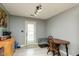 Eat-in kitchen features natural lighting, wood-look flooring, and access to the backyard at 4704 Whitview Ln, Indianapolis, IN 46237