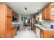 Well-lit kitchen with stainless steel appliances, light wood cabinets and sleek countertops at 4704 Whitview Ln, Indianapolis, IN 46237