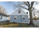 The backyard of the home is fenced-in and features a large tree at 5068 W 10Th St, Indianapolis, IN 46224