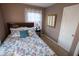 Calming bedroom with a full bed, soft lighting, and a serene atmosphere for restful nights at 5068 W 10Th St, Indianapolis, IN 46224