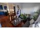 Open-concept living space with direct sightlines from kitchen to the lounge area filled with plants at 5068 W 10Th St, Indianapolis, IN 46224