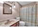 Functional bathroom features a vanity with mirror and shower with colorful curtain at 5451 Buttonwood Dr, Noblesville, IN 46062