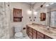 Traditional bathroom with a marble countertop, wood vanity, and tile flooring at 5451 Buttonwood Dr, Noblesville, IN 46062