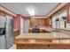 Well-lit kitchen showcases stainless steel appliances and plenty of counter space at 5451 Buttonwood Dr, Noblesville, IN 46062