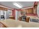 Functional kitchen with stainless steel appliances, wood cabinets, and ample counter space at 5451 Buttonwood Dr, Noblesville, IN 46062