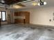 Spacious two-car garage with storage cabinets, ladder, and lighting at 5519 Fall Creek Rd, Indianapolis, IN 46220